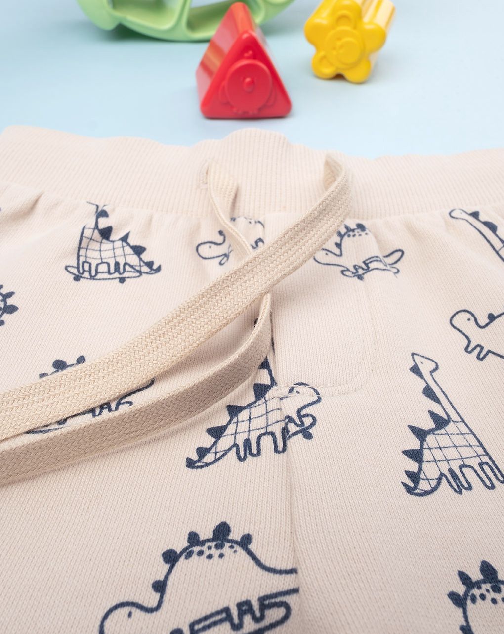 βρεφικό παντελόνι φούτερ μπεζ με δεινόσαυρους για αγόρι - Prénatal