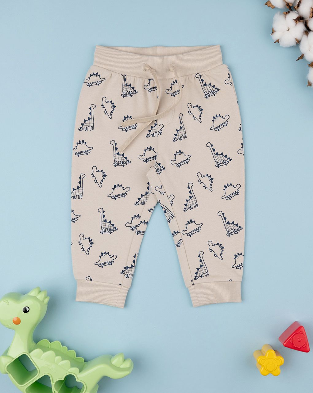 βρεφικό παντελόνι φούτερ μπεζ με δεινόσαυρους για αγόρι