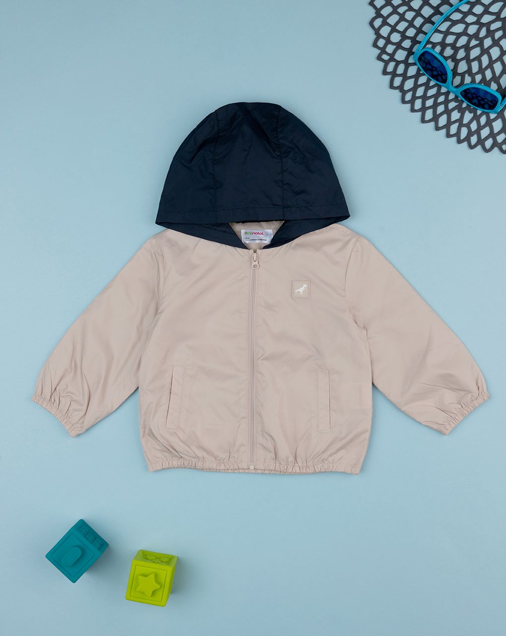 βρεφικό αντιανεμικό μπουφάν μπεζ/μπλε με δεινόσαυρο για αγόρι
