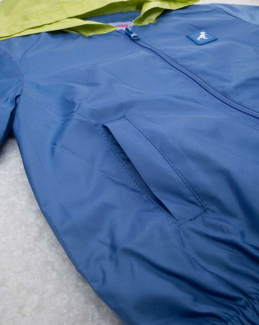 βρεφικό αντιανεμικό μπουφάν λαχανί/μπλε με δεινόσαυρο για αγόρι - Prénatal